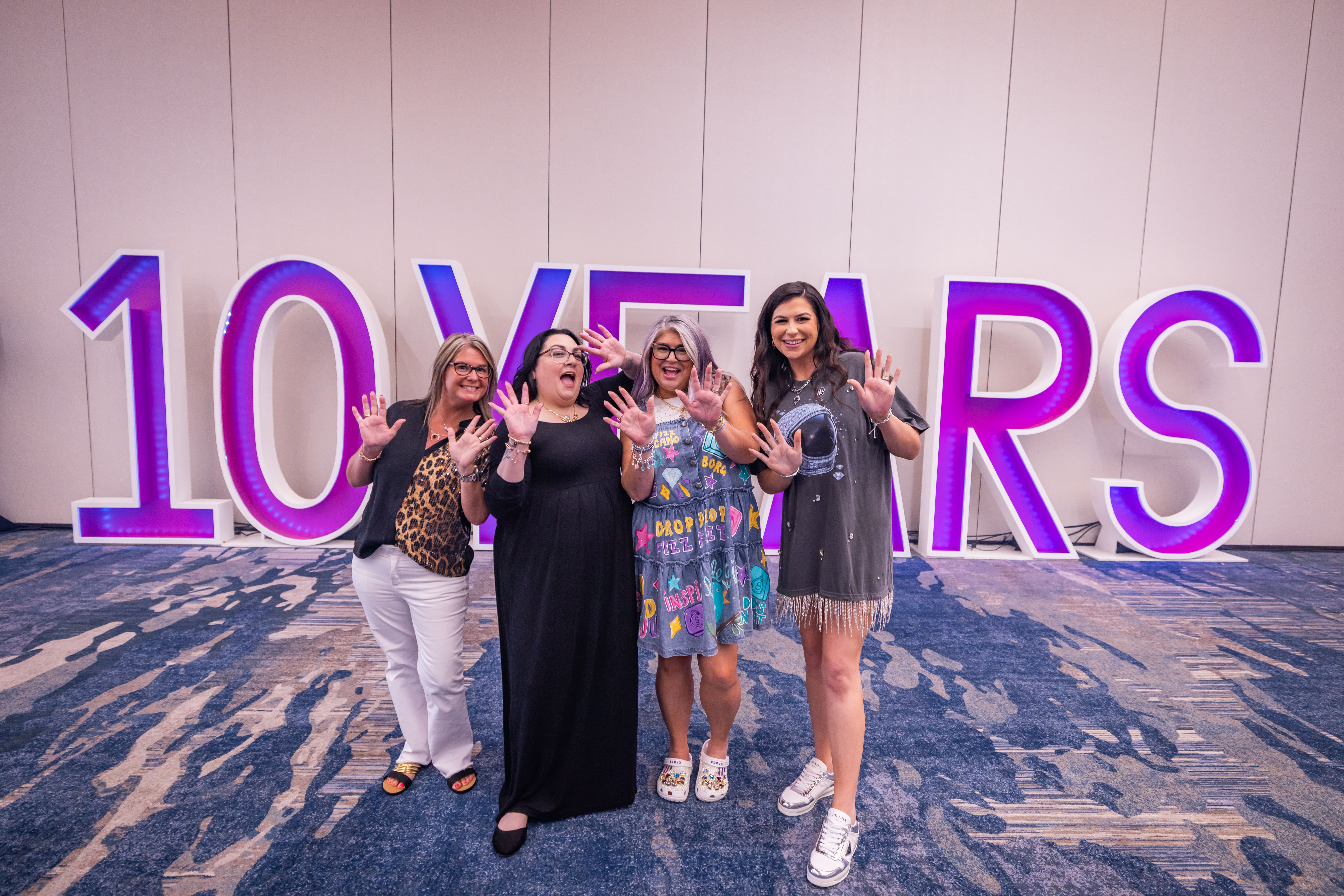 Bomb Party Founder and Independent Jewelry Consultants celebrating at a jewelry event, Fizztopia.